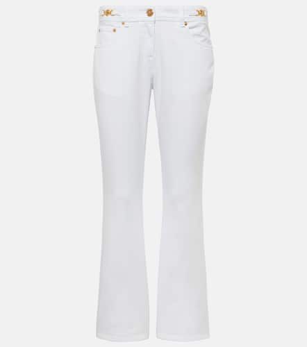 Jeans flared adornados de tiro bajo - Versace - Modalova