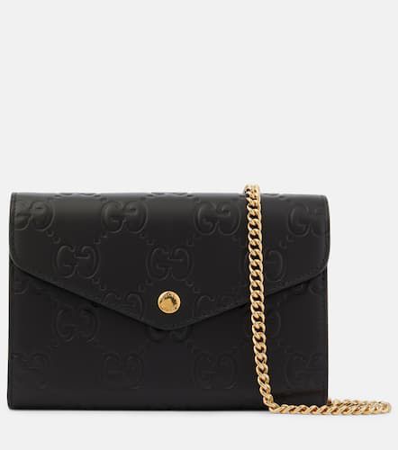 GG debossed leather wallet on chain - Gucci - Modalova