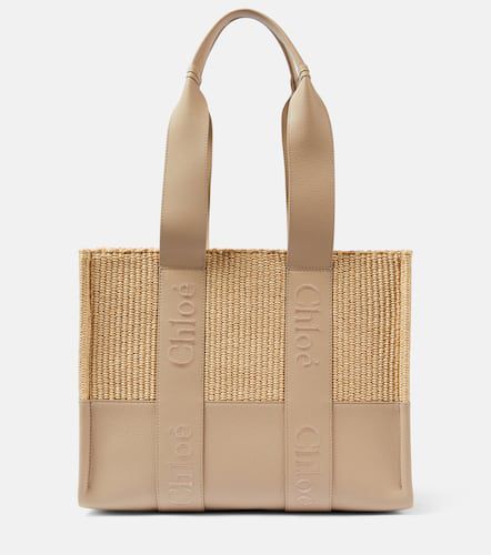 ChloÃ© Woody Medium leather-trimmed raffia tote bag - Chloe - Modalova