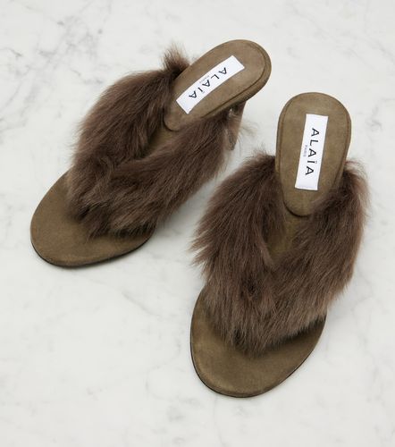 Alaïa Mules 90 in suede con shearling - Alaia - Modalova