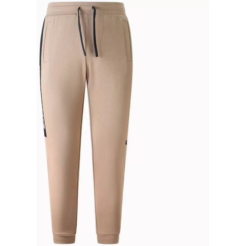 Pantaloni Sportivi Pantalone tuta con logo per uomo - Emporio Armani EA7 - Modalova