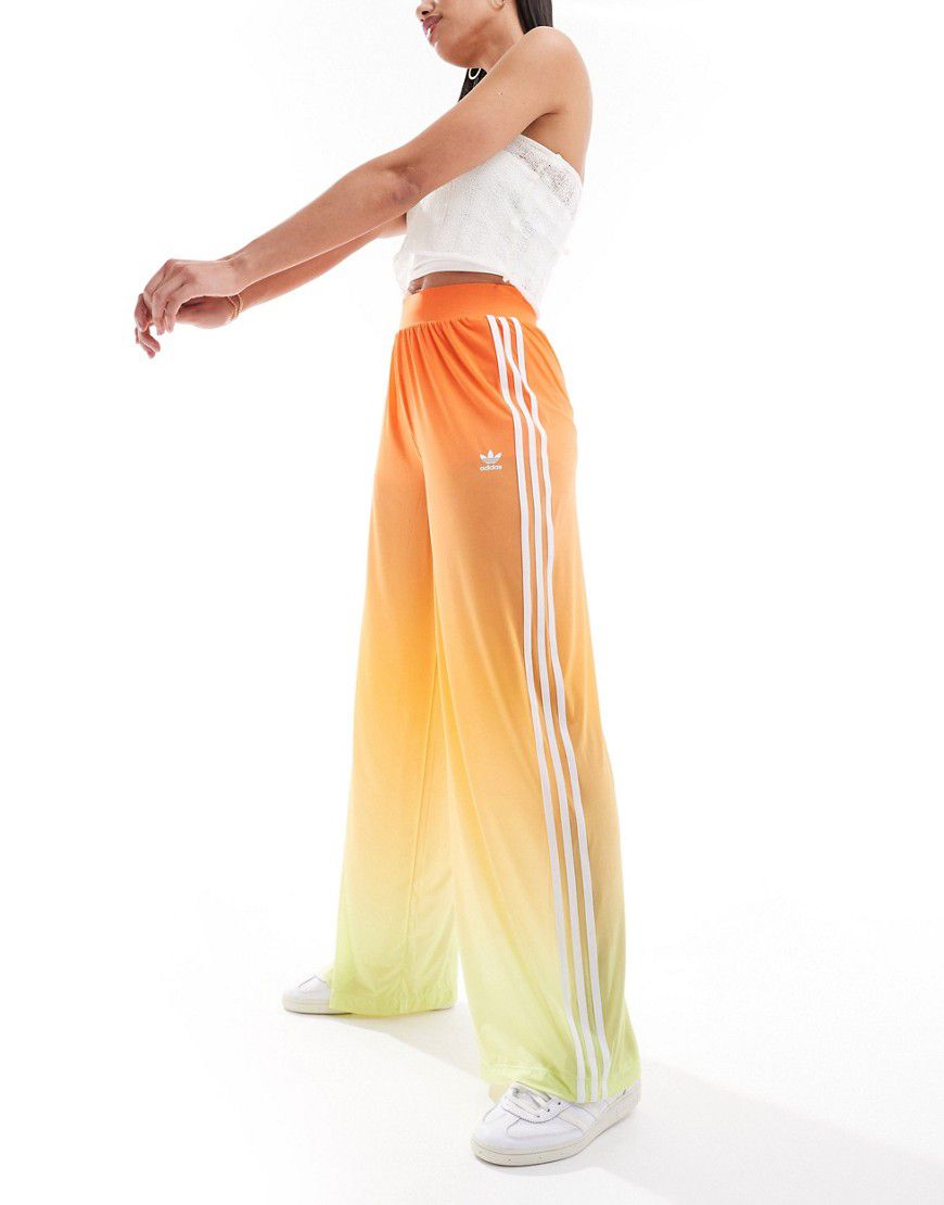 Pantaloni a fondo ampio in tessuto a rete sfumato - adidas Originals - Modalova