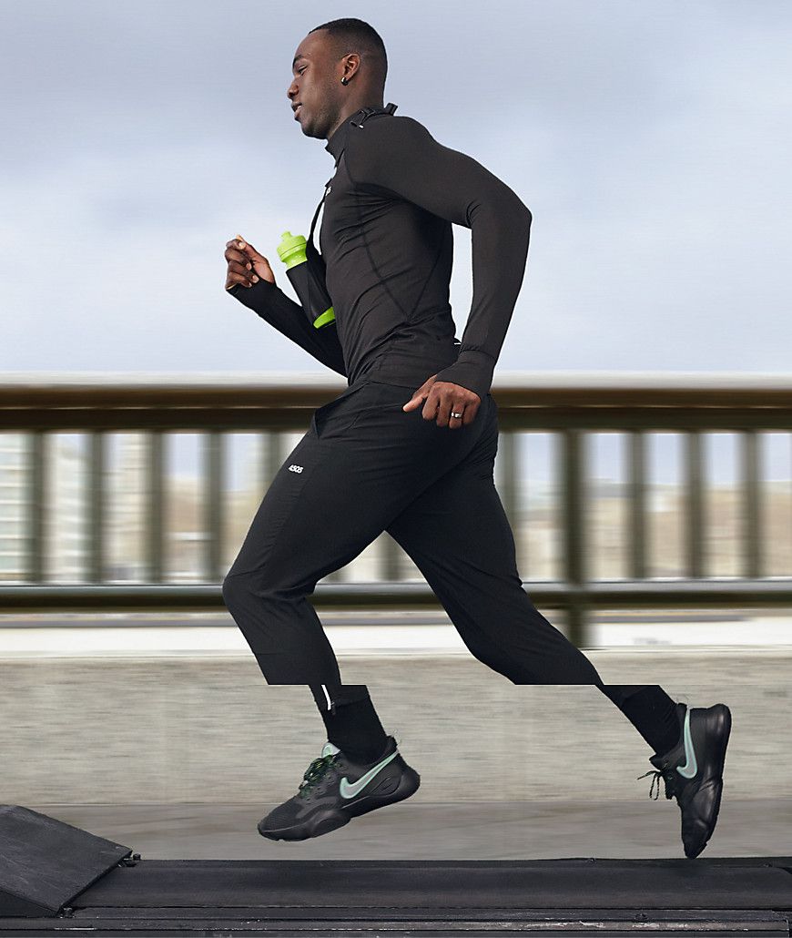 Joggers da corsa skinny affusolati con zip riflettente - ASOS - Modalova