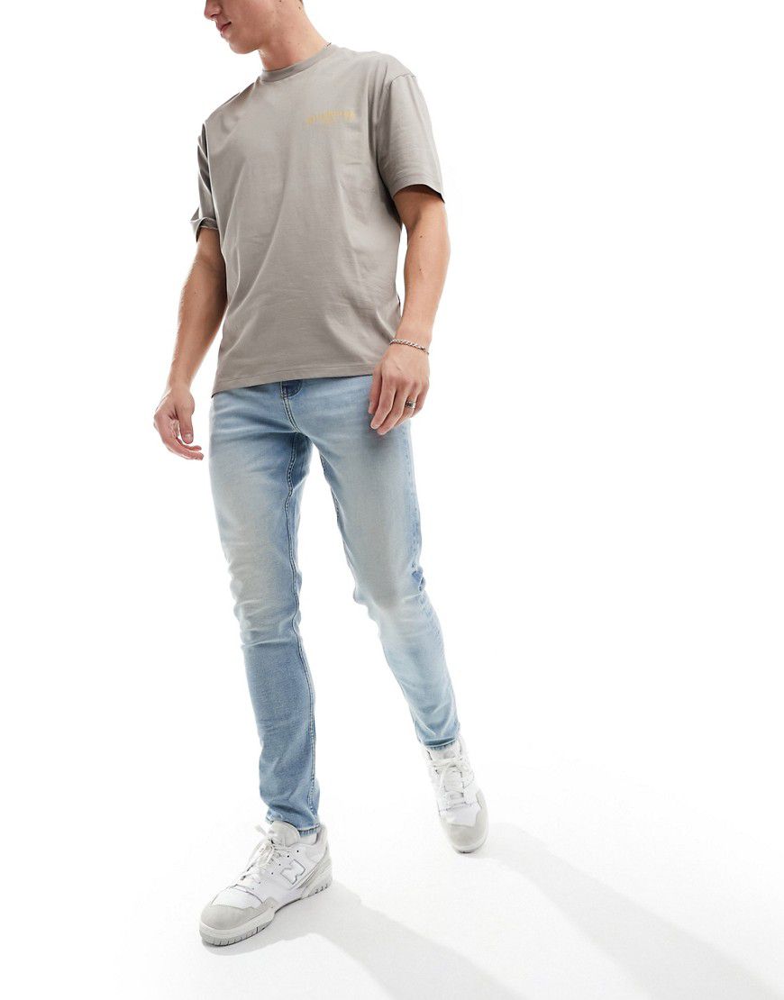 Jeans skinny lavaggio chiaro - ASOS DESIGN - Modalova