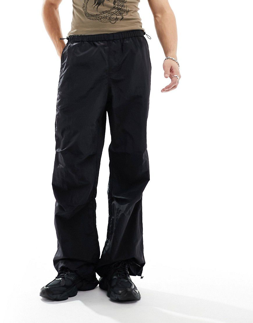 Pantaloni neri larghi in nylon - ASOS DESIGN - Modalova