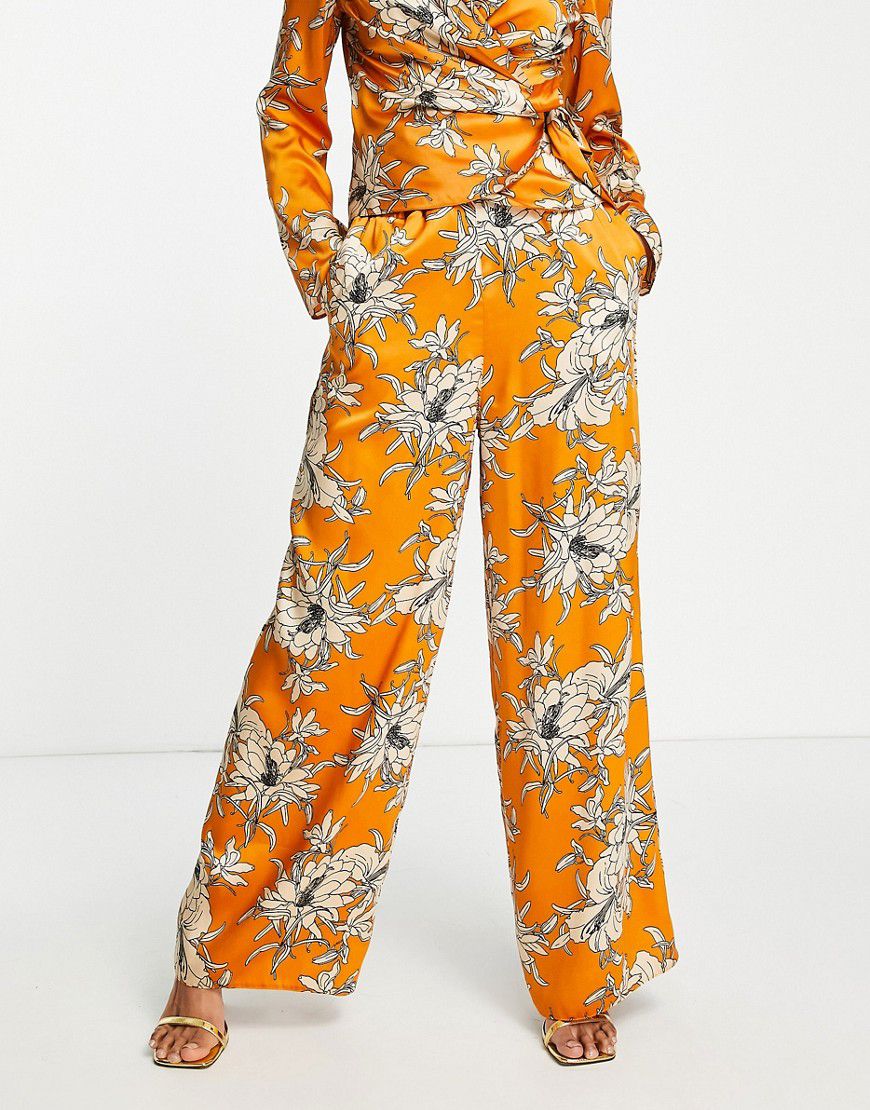 Pantaloni a fondo ampio in raso arancione a fiori in coordinato - ASOS DESIGN - Modalova