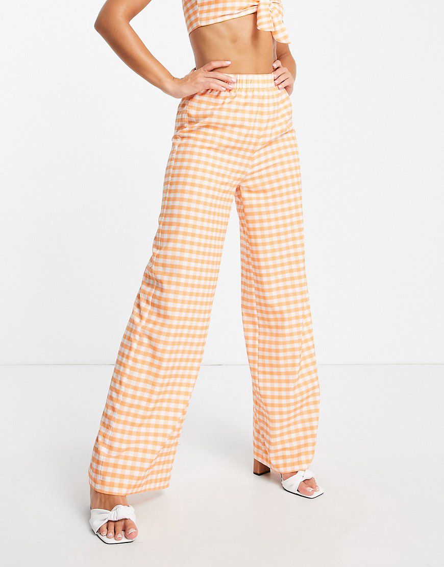Pantaloni con fondo molto ampio e vita elasticizzata a quadretti arancioni in coordinato - Extro & Vert - Modalova