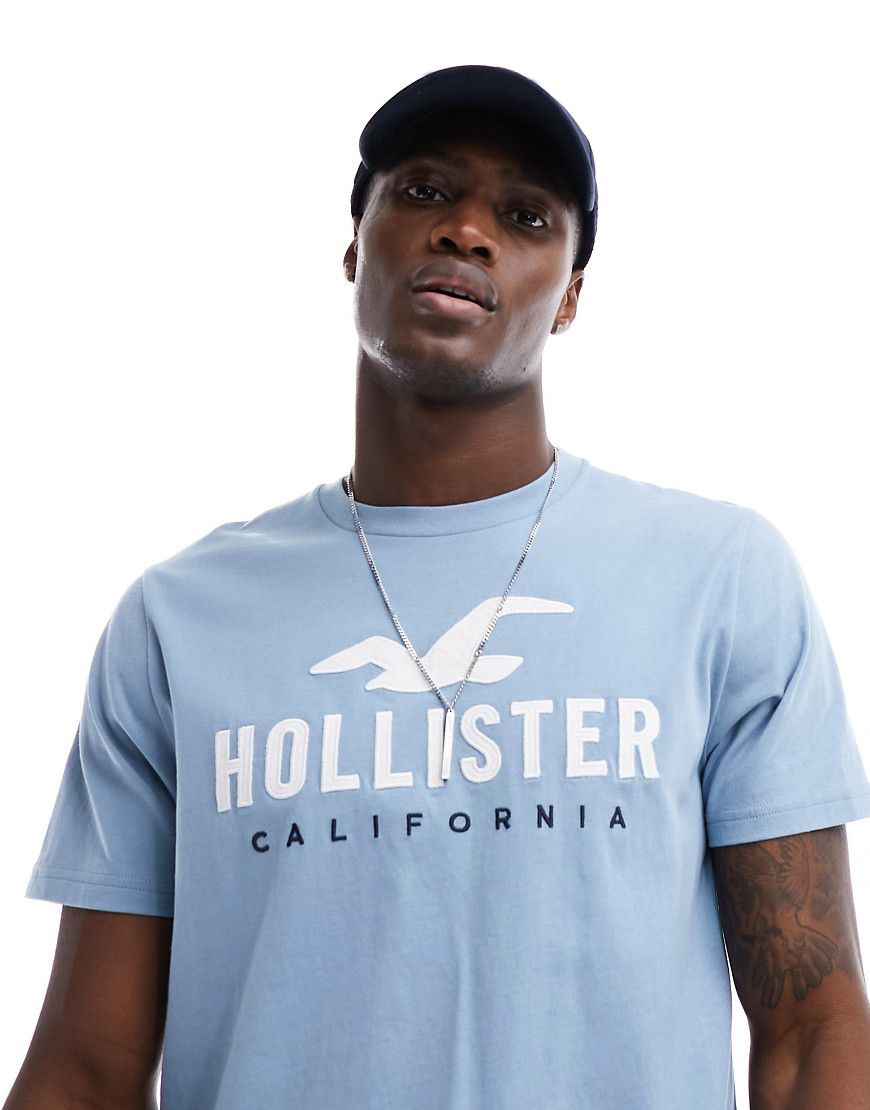 T-shirt tecnica azzurra con logo - Hollister - Modalova