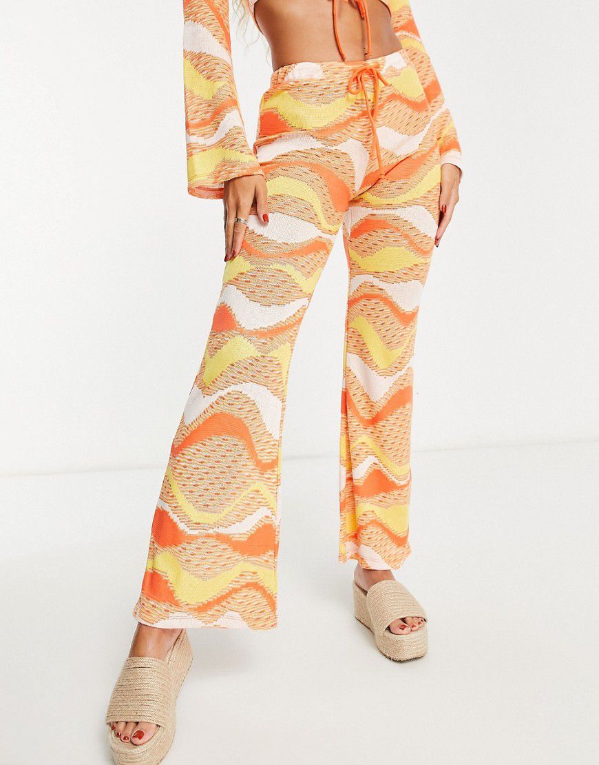 Pantaloni da festival a zampa arancioni in maglia allacciati sul davanti in coordinato - New Girl Order - Modalova