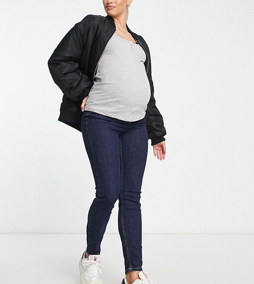 Jeans skinny indaco con fascia sopra al pancione - New Look Maternity - Modalova