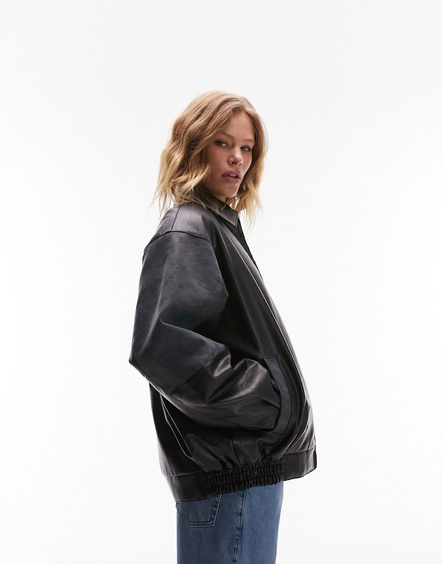 Giacca bomber in pelle sintetica nera con colletto e maniche in camoscio sintetico a contrasto - Topshop - Modalova