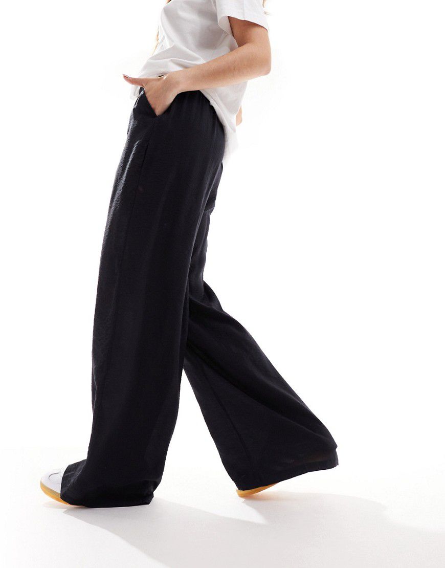 Pantaloni neri con vita alta e fondo ampio - Vero Moda - Modalova